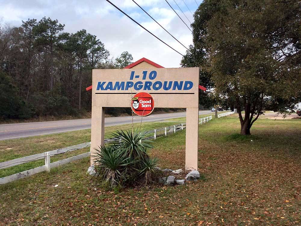 Park entrance sign with Good Sam logo on it at I-10 KAMPGROUND