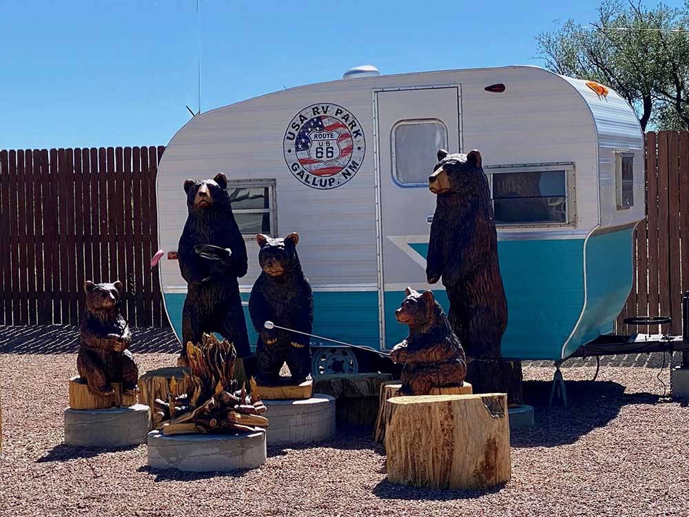 Bear statues next to a small trailer at USA RV PARK