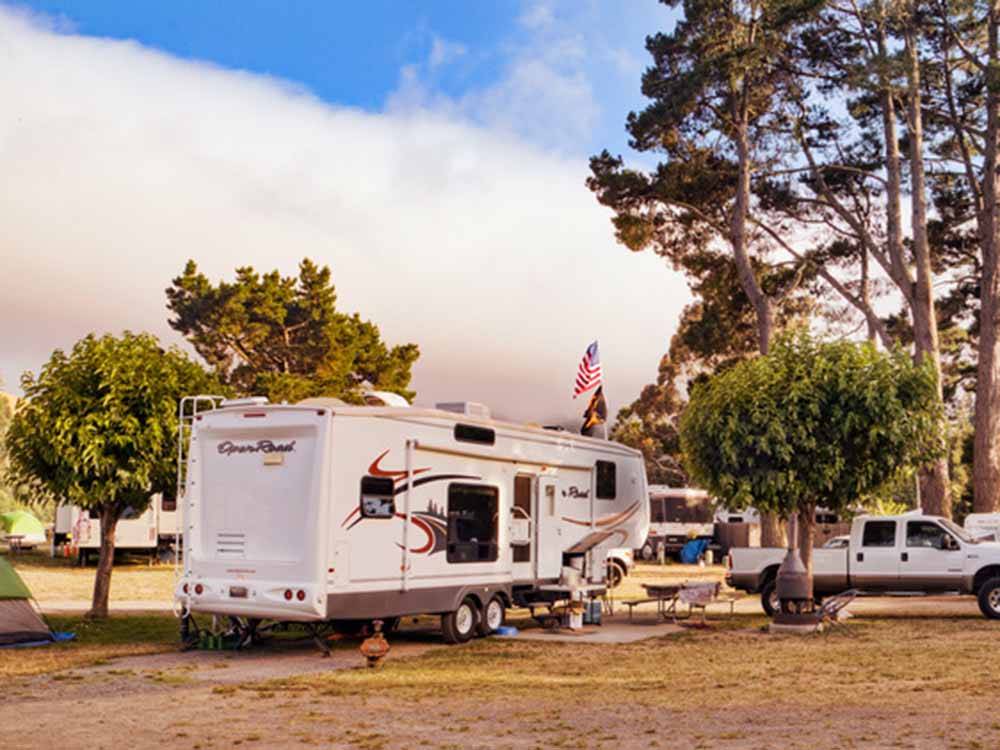 A fifth wheel trailer parked in a gravel site at CASINI RANCH FAMILY CAMPGROUND