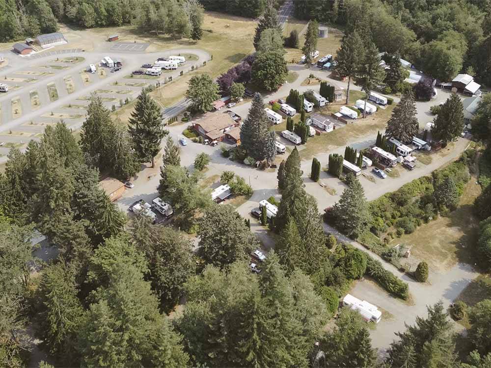 An aerial view of the wooded campsites at HARMONY LAKESIDE RV PARK & DELUXE CABINS