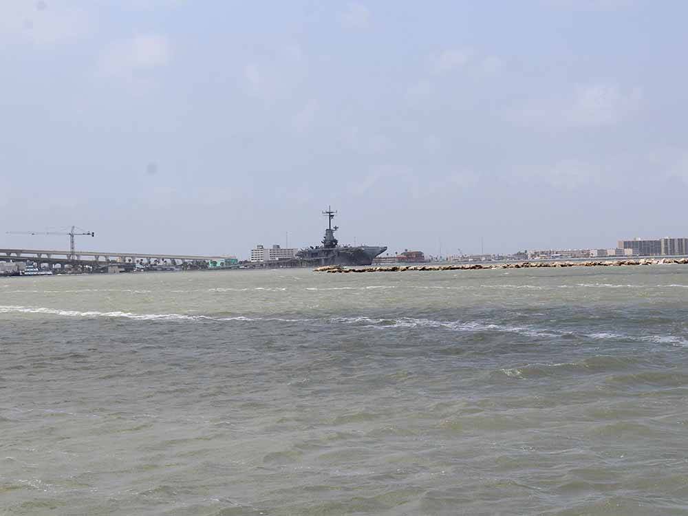 A view of the aircraft carrier nearby at PADRE PALMS RV PARK