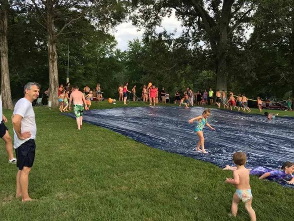 Kids playing on a slip-and-slide at CHRISTOPHER RUN CAMPGROUND