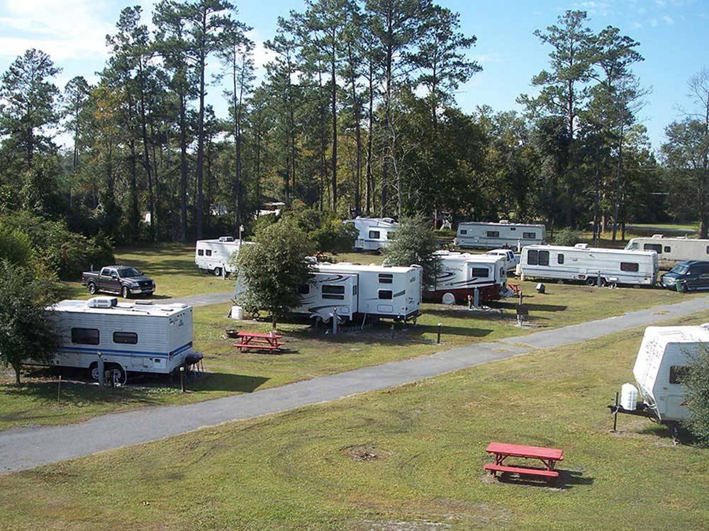 Trailers camping on grass at LAKE CITY CAMPGROUND