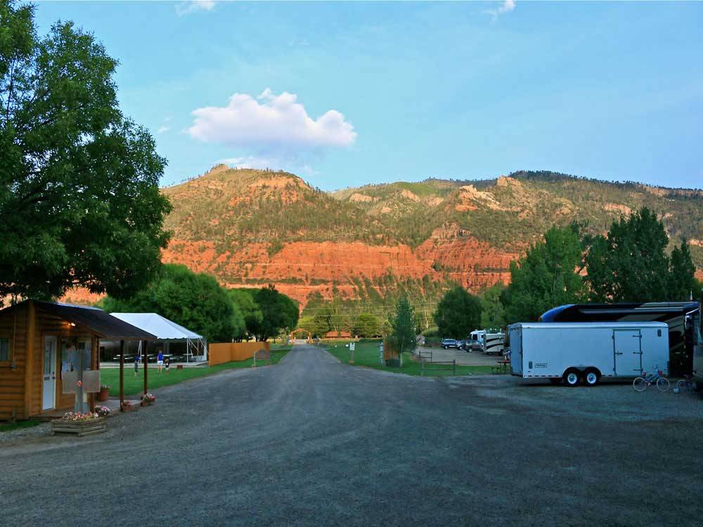 Looking down the gravel road at ALPEN ROSE RV PARK
