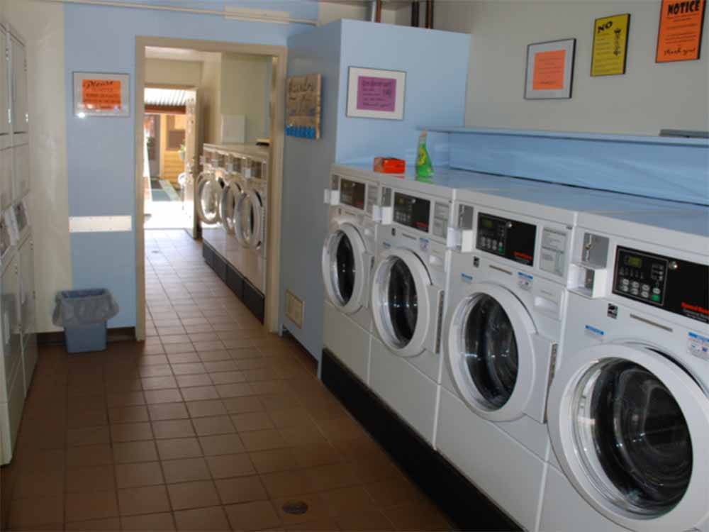 A line of front loading washing machines at ALPEN ROSE RV PARK