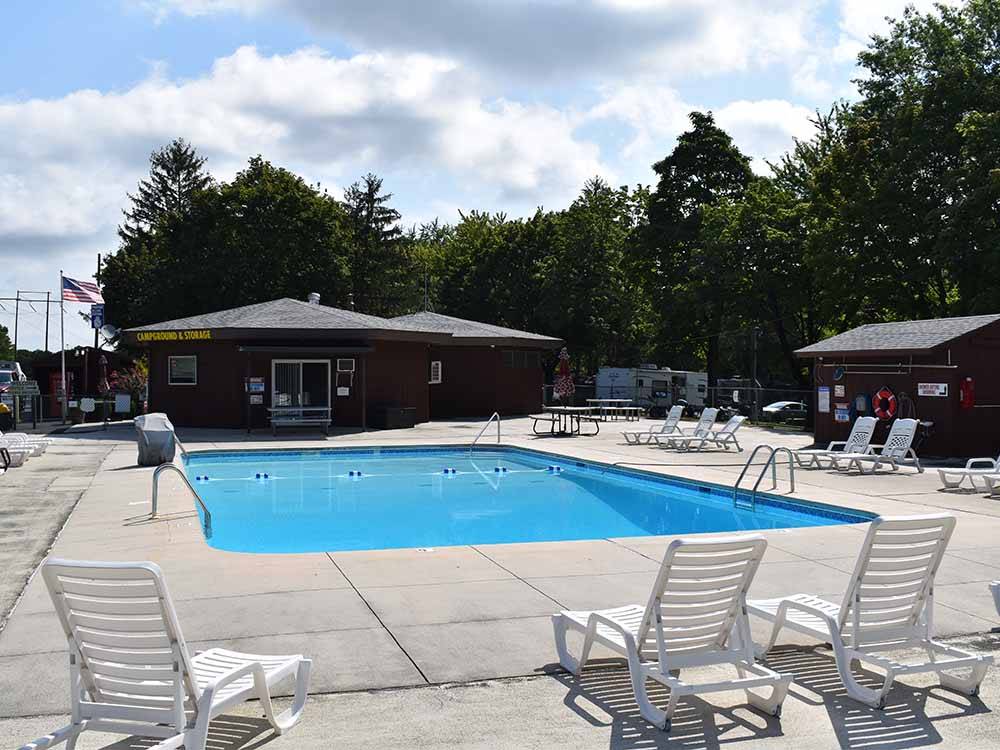The pool area with seating at HARRISBURG EAST CAMPGROUND & STORAGE