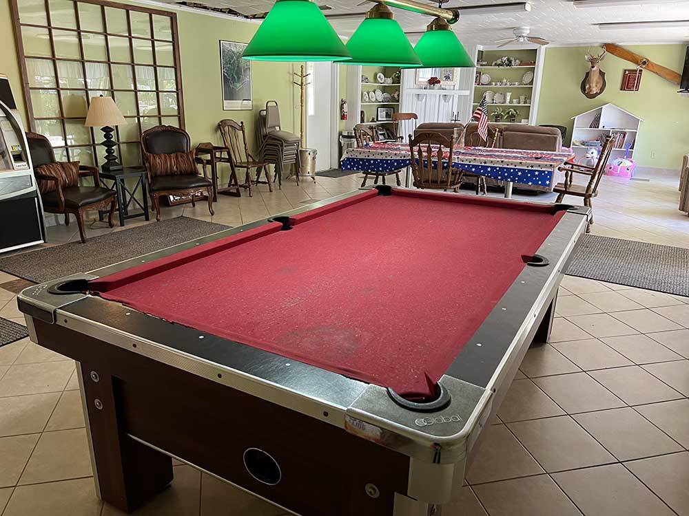 A red pool table in the rec room at TALLAHASSEE EAST CAMPGROUND