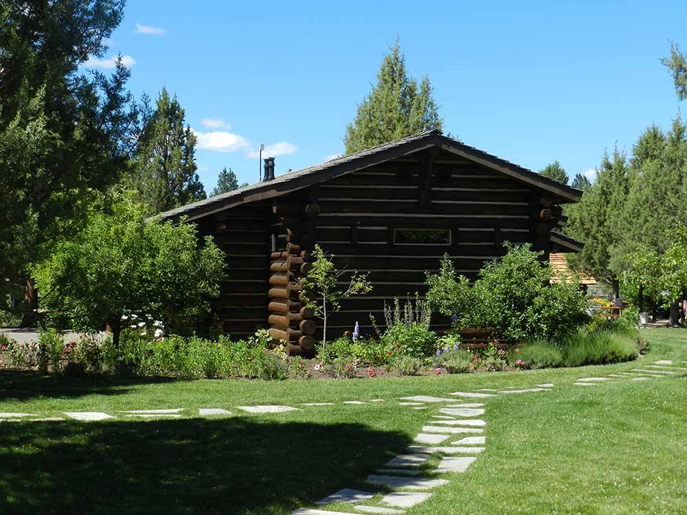 Log cabin with deck at BEND/SISTERS GARDEN RV RESORT