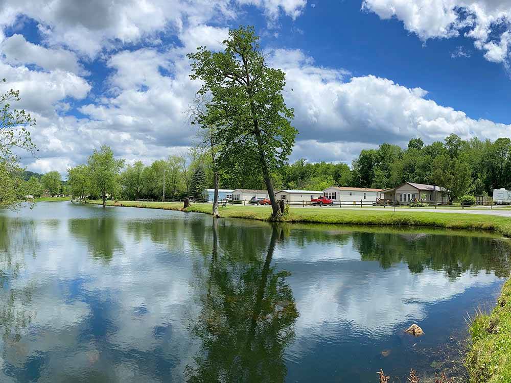 The picturesque lake at FRIENDSHIP VILLAGE CAMPGROUND & RV PARK