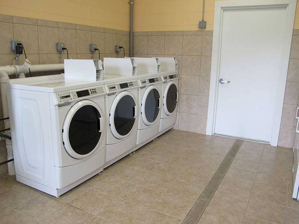 Laundry room with washer and dryers at THE DEPOT TRAVEL PARK