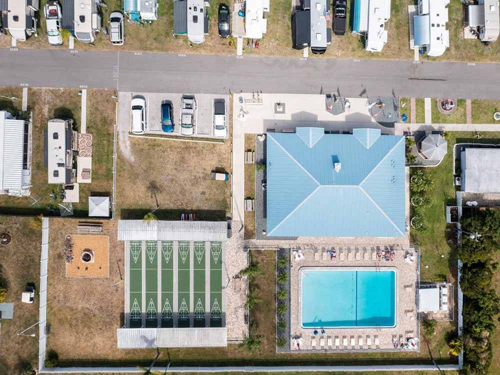 An overhead view of the recreation hall, pool, and shuffleboard courts at TAMIAMI RV PARK