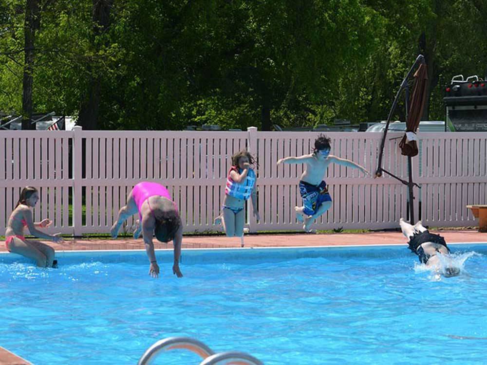 Kids swimming in pool at CAMP BELL CAMPGROUND