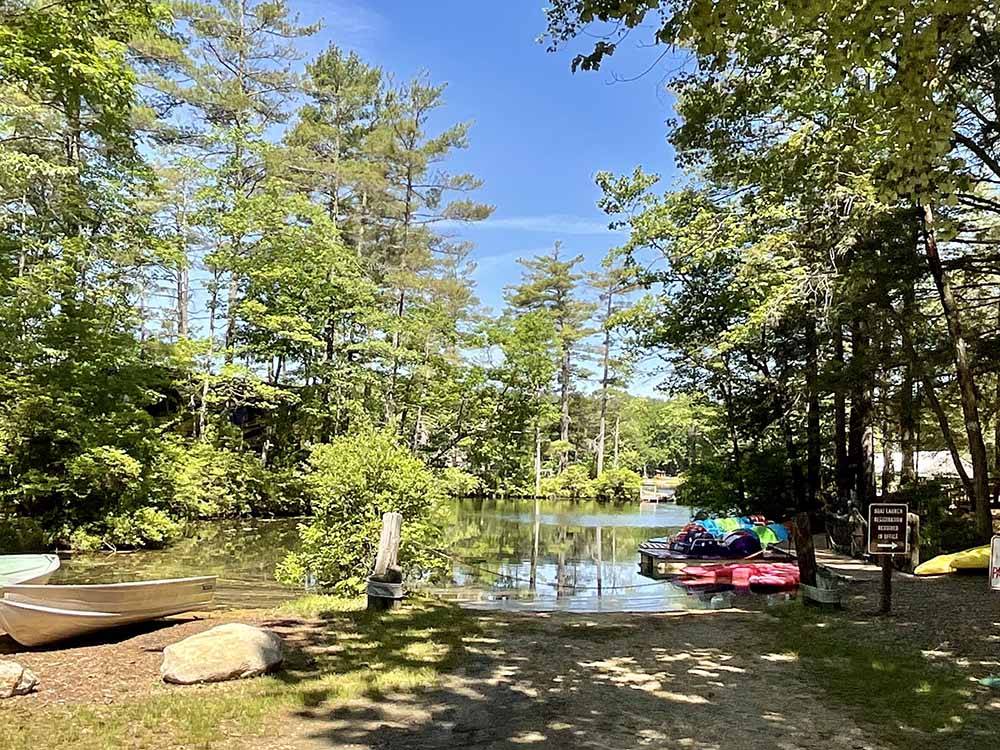 The lake with boats and a dock at PINE ACRES FAMILY CAMPING RESORT