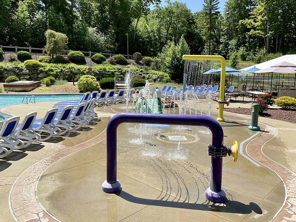 The splash pad next to the swimming pool at PINE ACRES FAMILY CAMPING RESORT