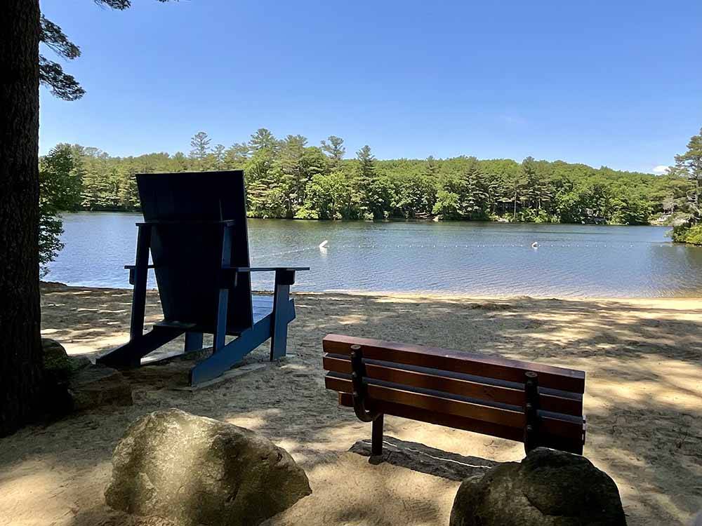 An oversized wooden chair overlooking the water at PINE ACRES FAMILY CAMPING RESORT