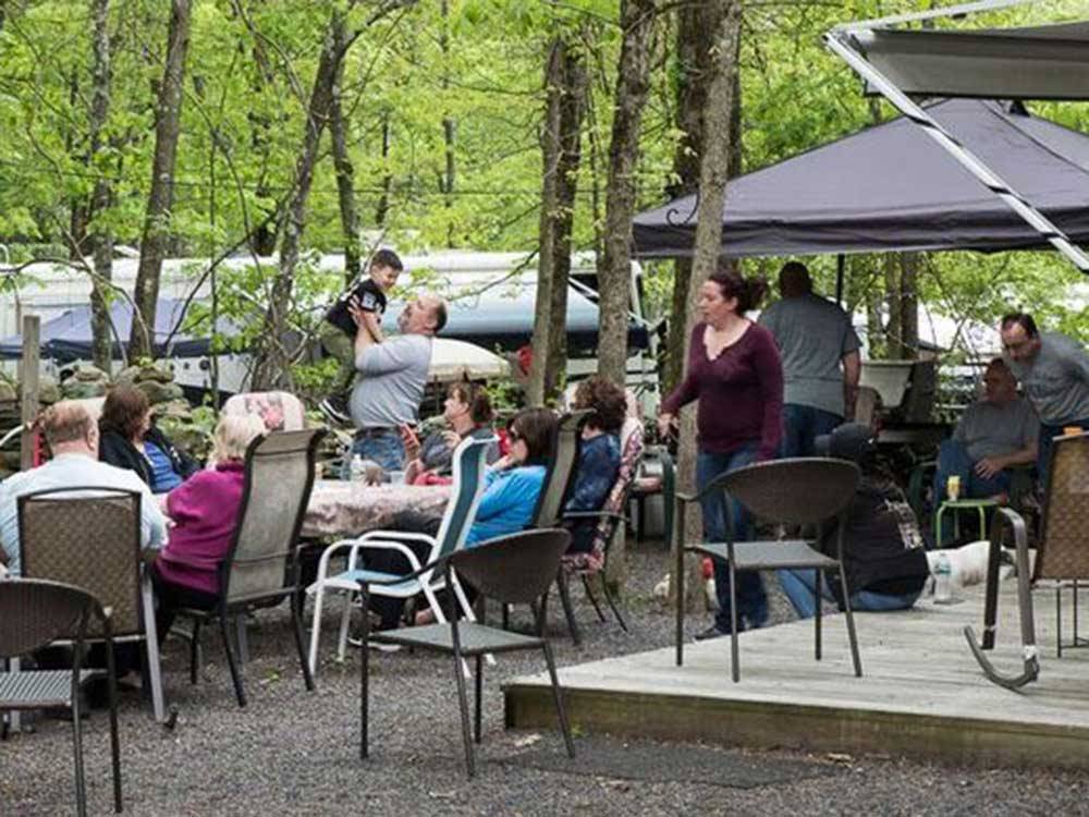 Patio area with picnic tables at FOUR SEASONS CAMPGROUNDS