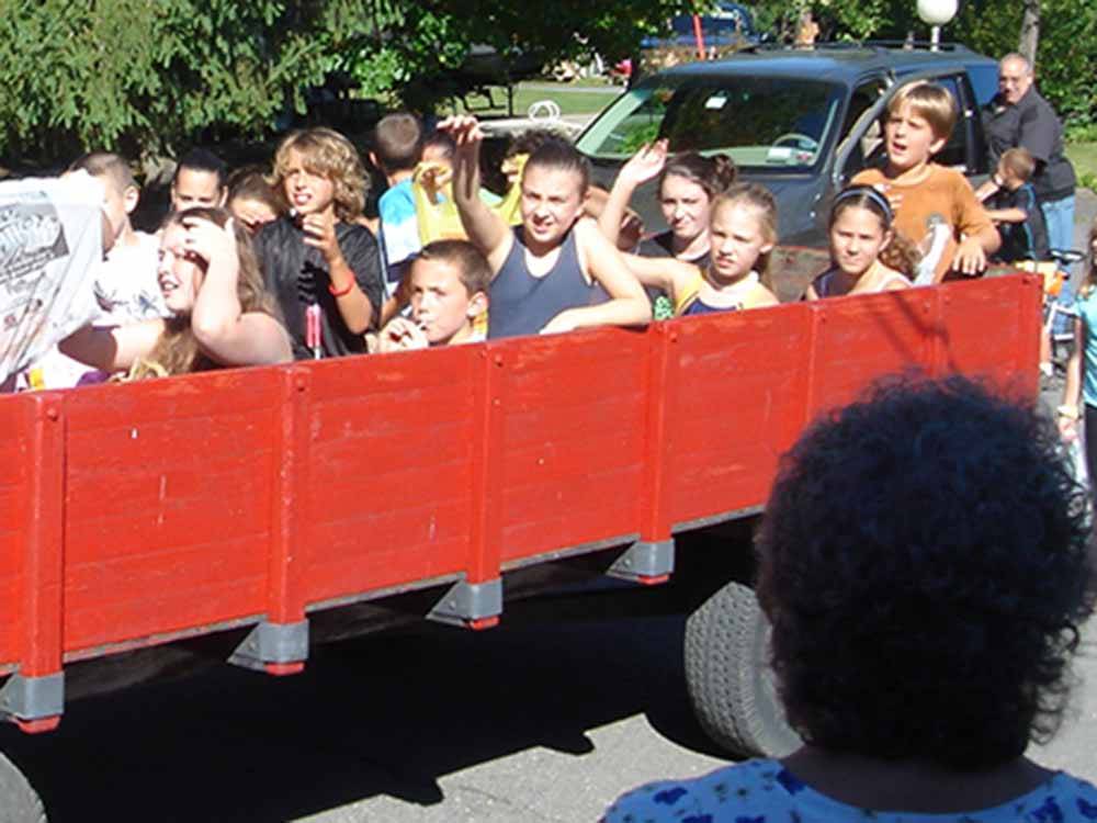 Large group of kids on a wagon ride at FOUR SEASONS CAMPGROUNDS