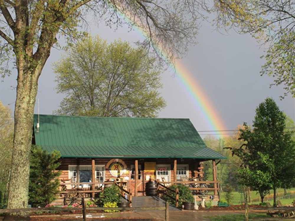 The front store with a rainbow behind it at HUNTINGTON FOX FIRE KOA