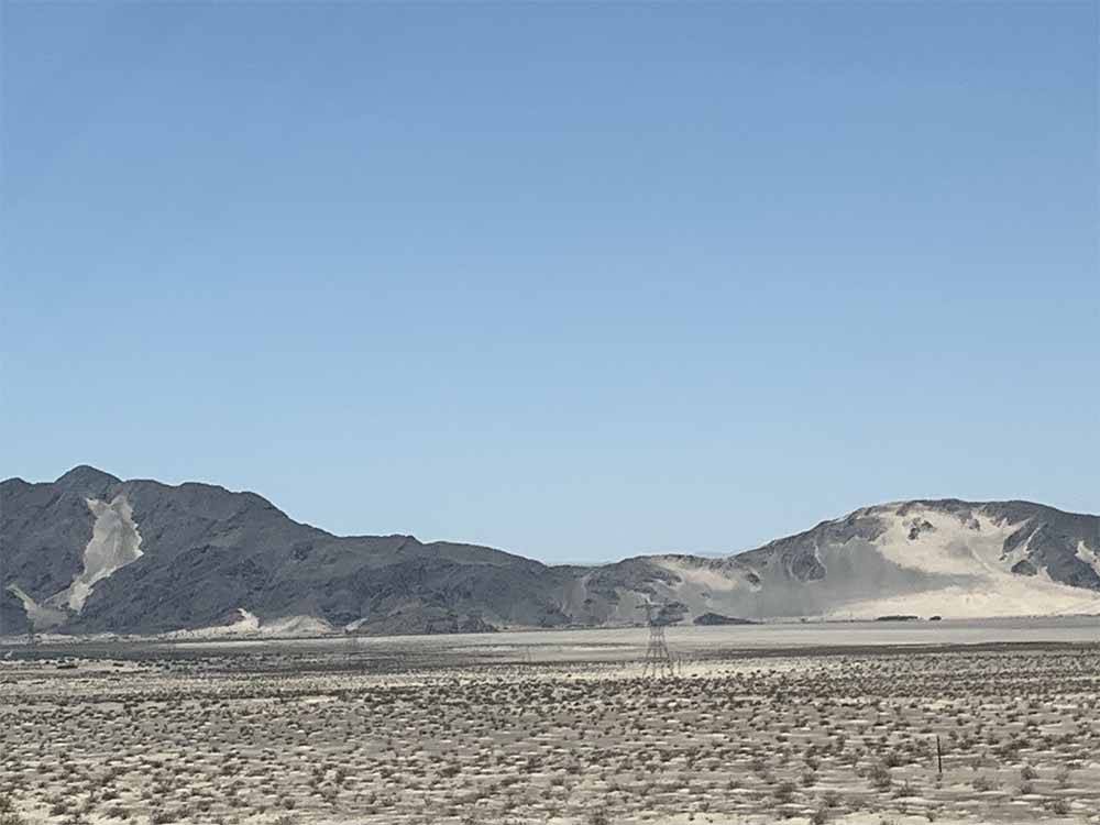 The desert with mountains at SHADY LANE RV CAMP
