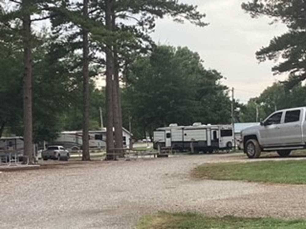 Trucks and trailers parked in sites at TREASURE ISLE RV PARK