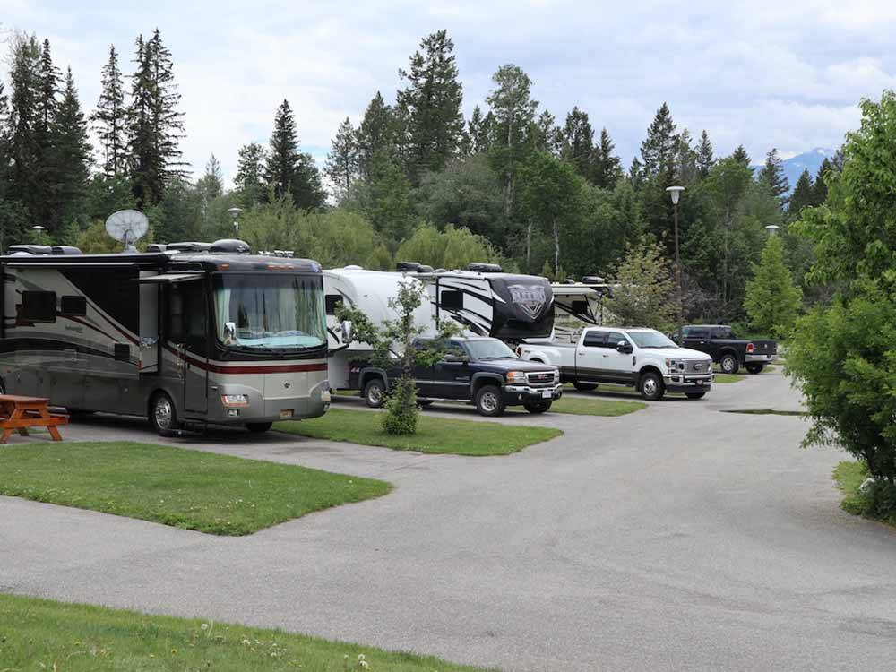 A row of filled RV sites at FAIRMONT HOT SPRINGS RESORT