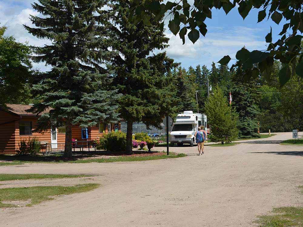 A couple walking down a gravel road at INDIAN HEAD CAMPGROUND