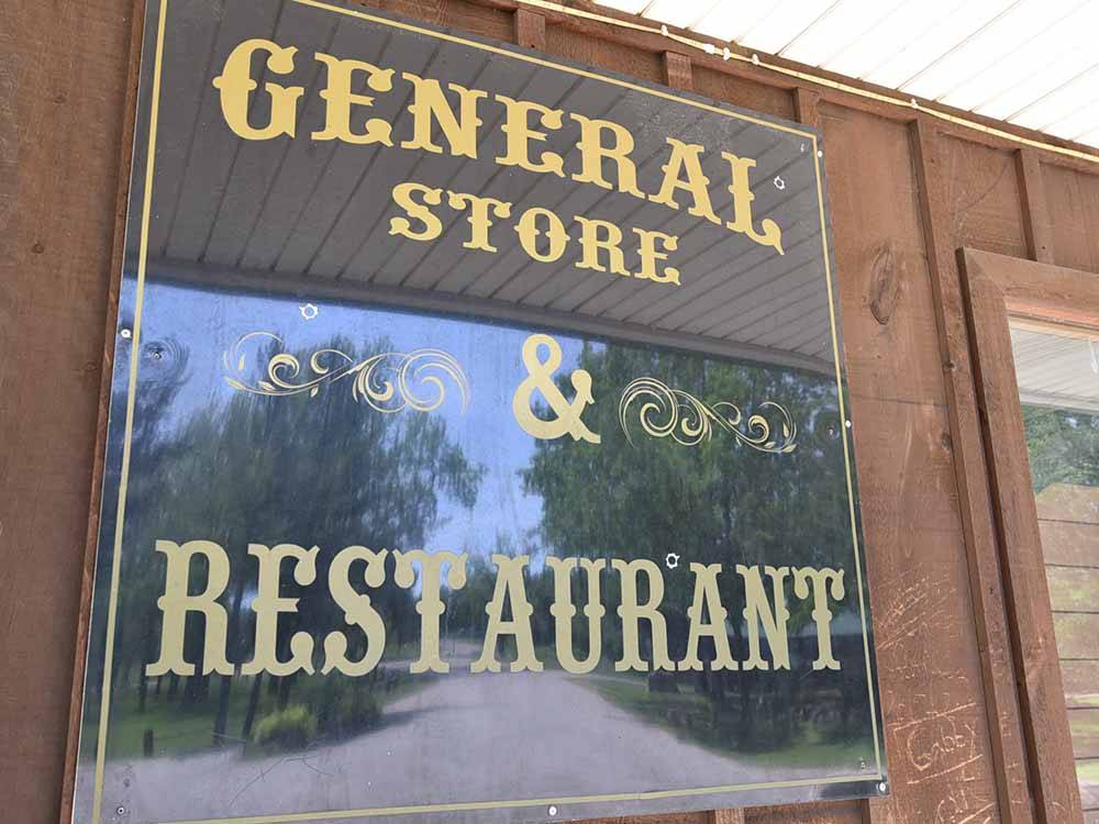 The sign to the general store and restaurant at BISSELL'S HIDEAWAY RESORT