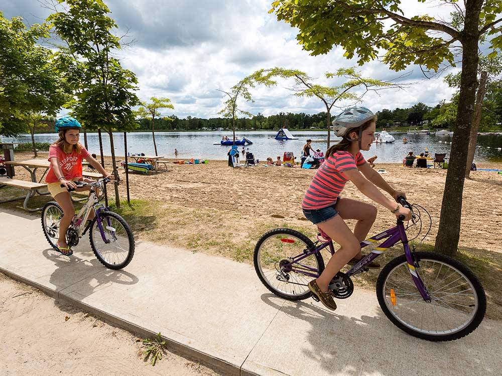 Kids riding on bikes at FISHERMAN'S COVE TENT & TRAILER PARK