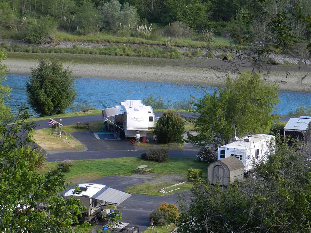 An aerial view of the campsites by the water at ATRIVERS EDGE RV RESORT