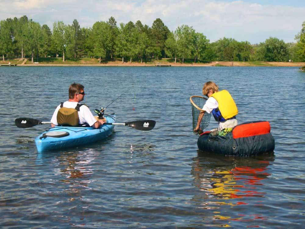 People kayaking on water at LAKE PARK CAMPGROUND & COTTAGES