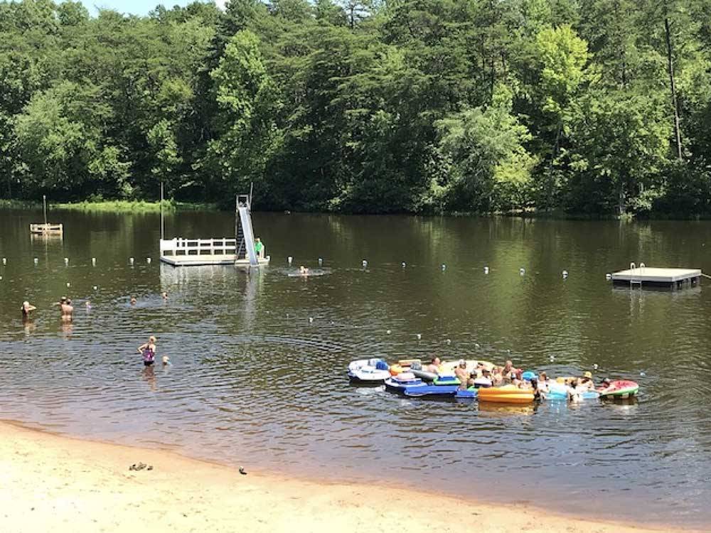 People enjoying recreation in the lake at PARADISE LAKE FAMILY CAMPGROUND