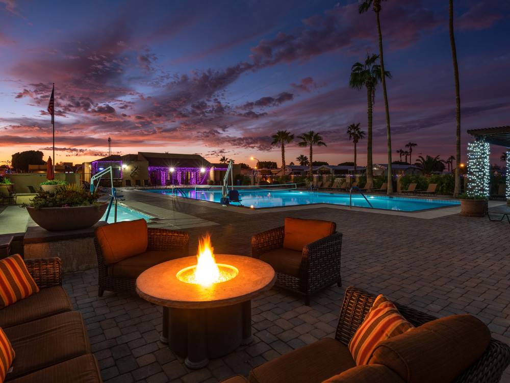 The swimming pool area at dusk at SUNDANCE RV RESORT