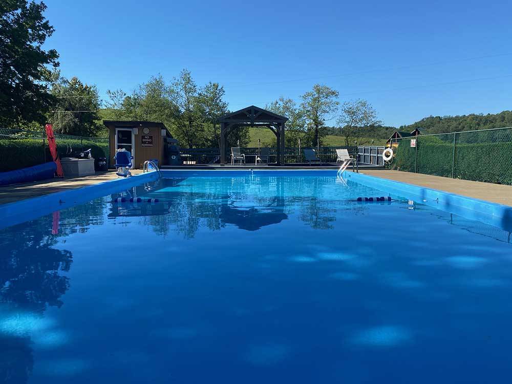 The fenced in swimming pool at BEAR RUN CAMPGROUND