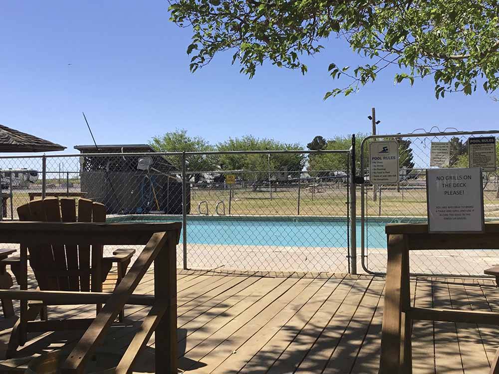 The fenced in swimming pool at FORT STOCKTON RV PARK