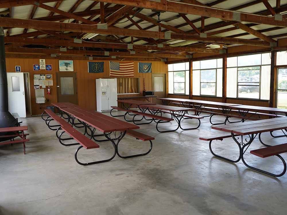 Picnic benches in one of the buildings at SPAULDING LAKE CAMPGROUND