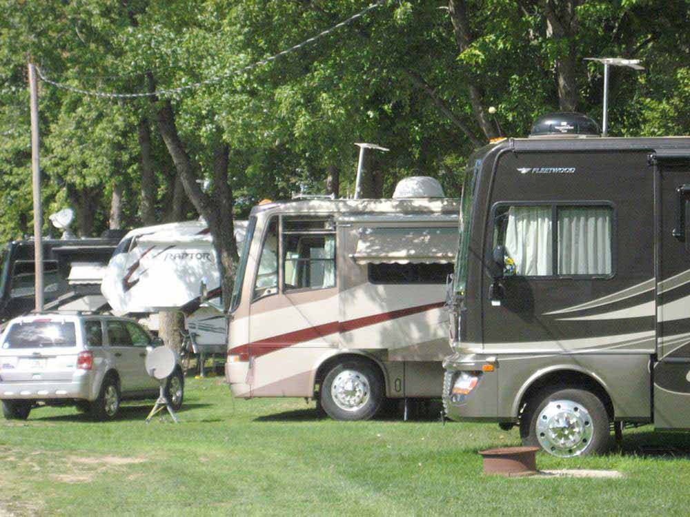 A row of motorhomes under trees at SPAULDING LAKE CAMPGROUND