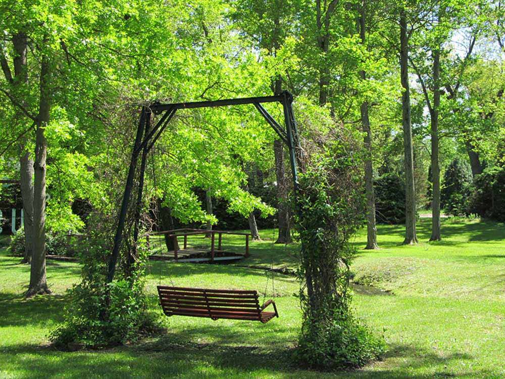 A swinging park bench at SPAULDING LAKE CAMPGROUND