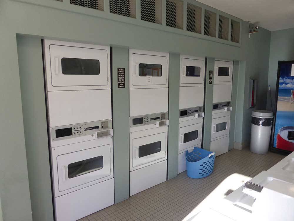 Laundry room with washers and dryers at RANCHO LOS COCHES RV PARK