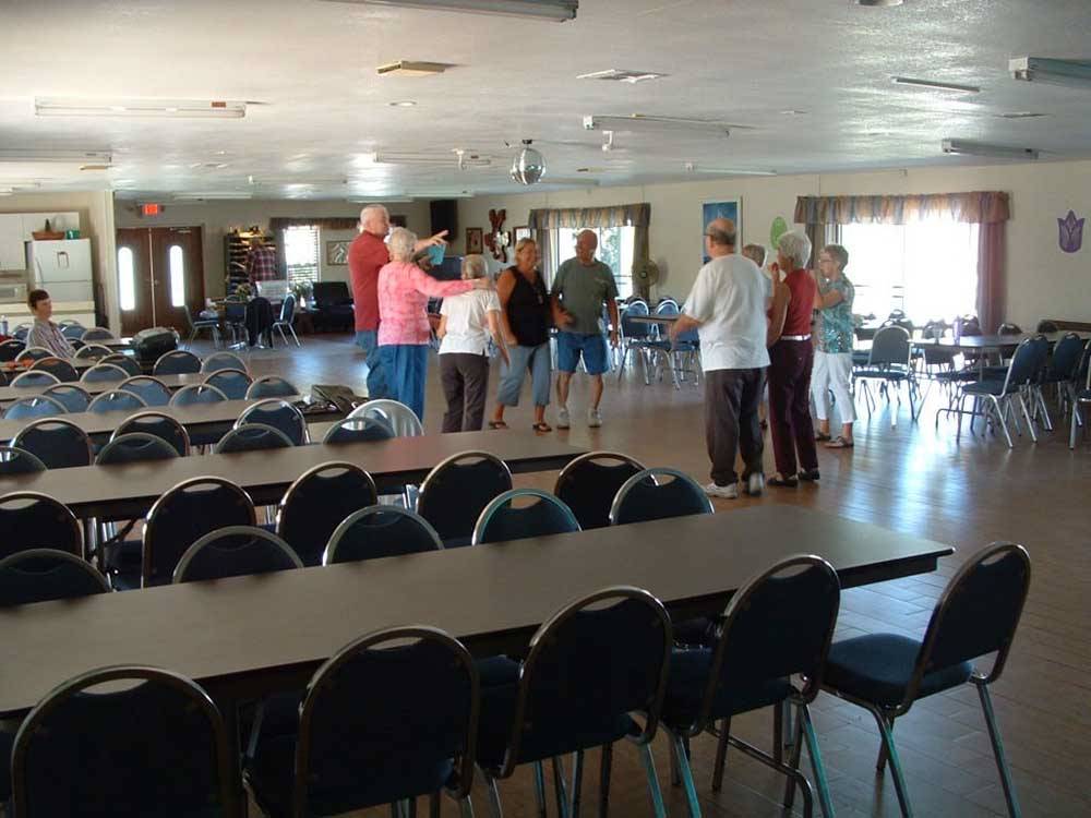 People standing in the rec hall at SEVEN SPRINGS TRAVEL PARK