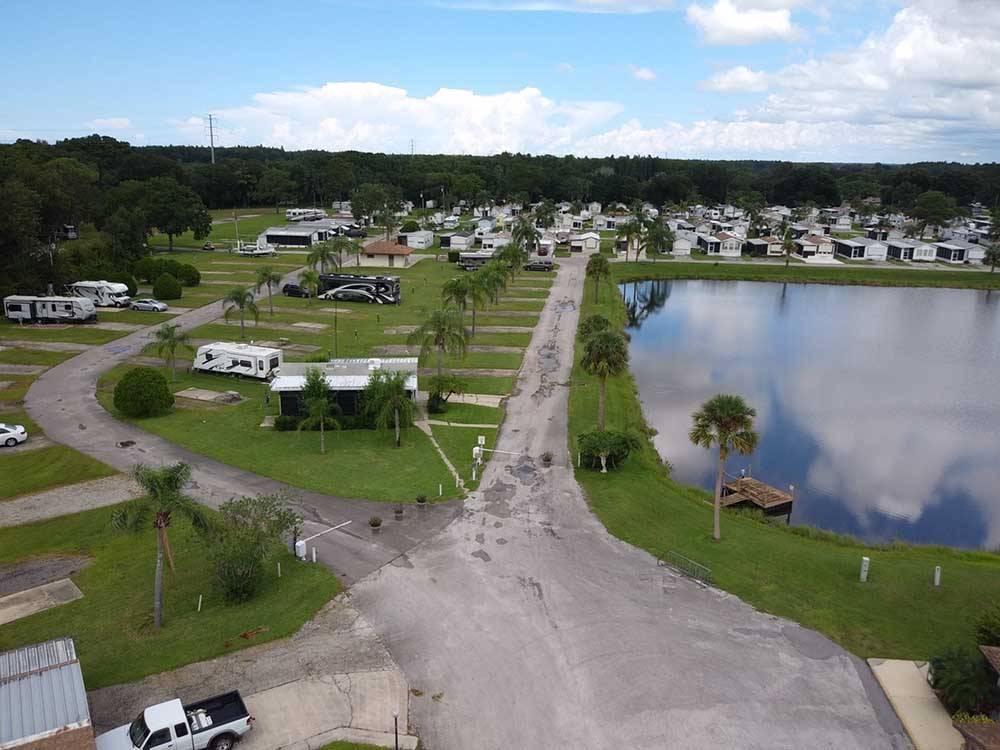 An aerial view of the main road next to the lake at SEVEN SPRINGS TRAVEL PARK