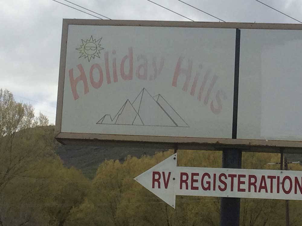 Another front sign with registration arrow at HOLIDAY HILLS RV PARK