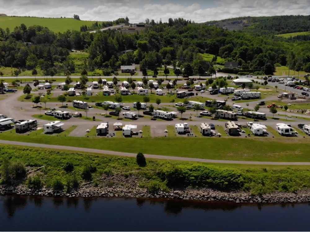 An aerial view of the back in RV sites by the water at HARTT ISLAND RV RESORT & WATERPARK
