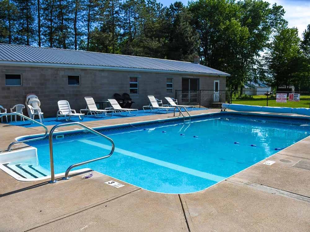 The swimming pool with lounge chairs at CHERRY GROVE CAMPGROUND