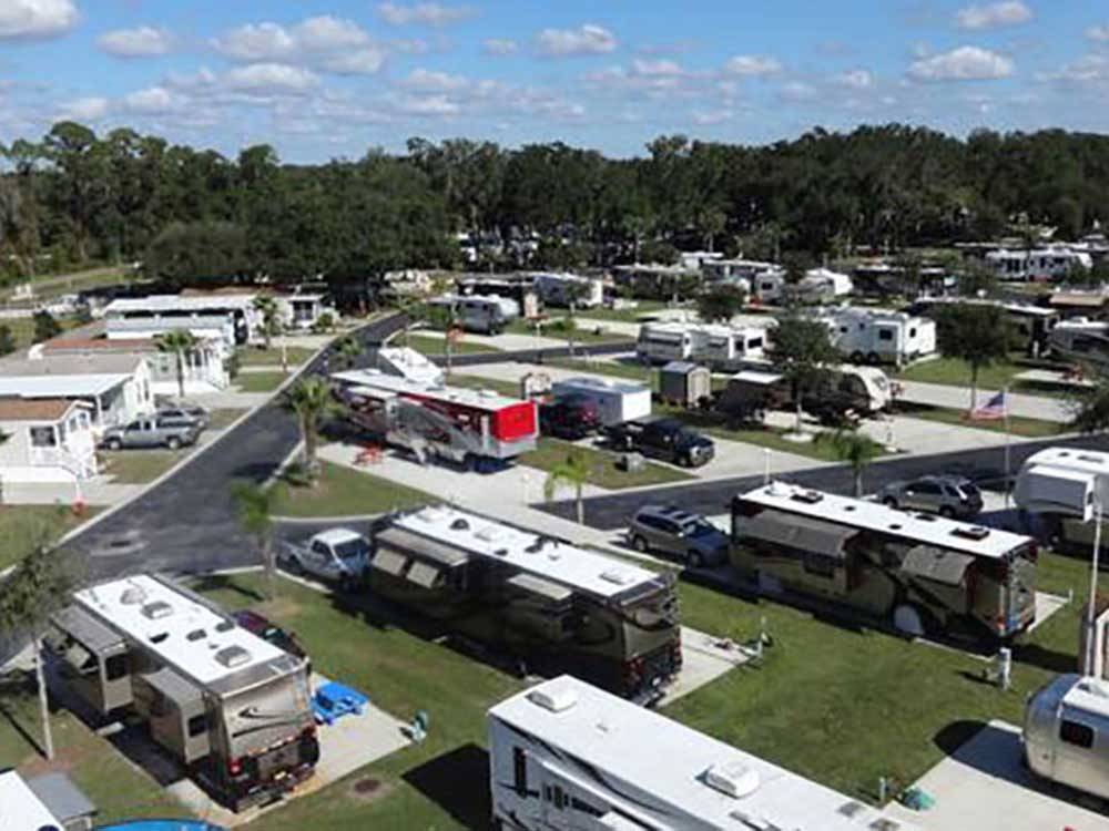 Well-groomed stalls with trailers backed into them at QUAIL RUN RV RESORT
