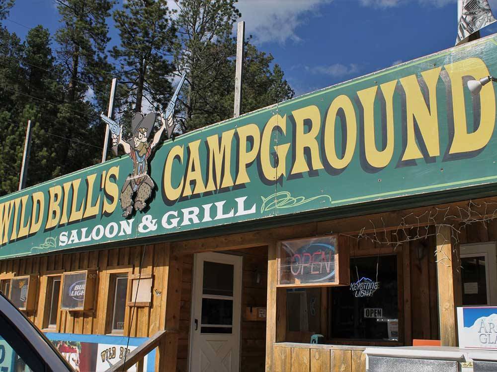 The sign on the front of the restaurant at WILD BILL'S CAMPGROUND, SALOON & GRILL
