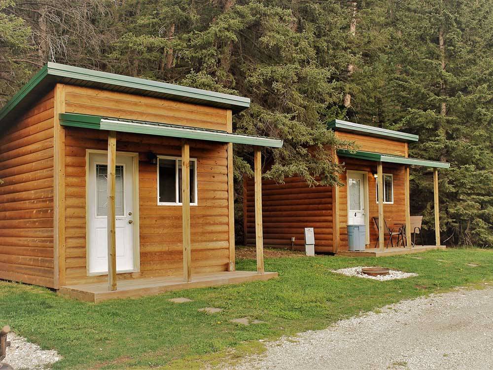 Two of the rustic cabin rentals at WILD BILL'S CAMPGROUND, SALOON & GRILL
