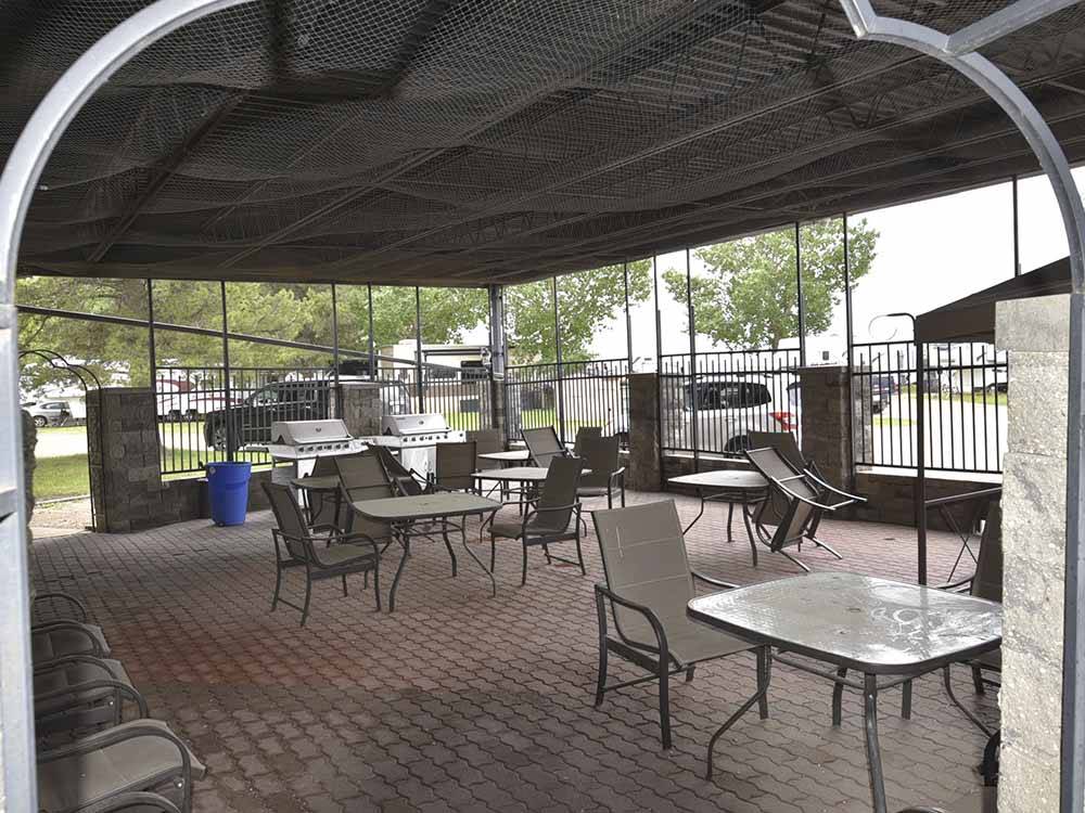 An outdoor seating area at GLOWING EMBERS RV PARK & TRAVEL CENTRE