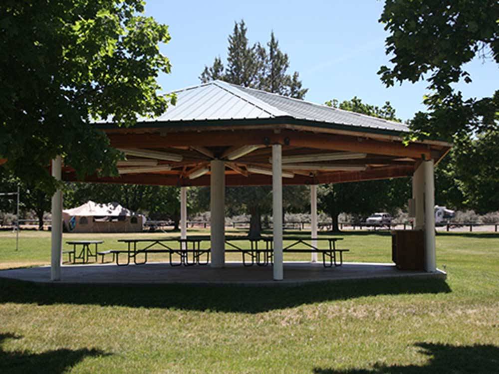 Picnic tables under the pavilion at CROOKED RIVER RANCH RV PARK