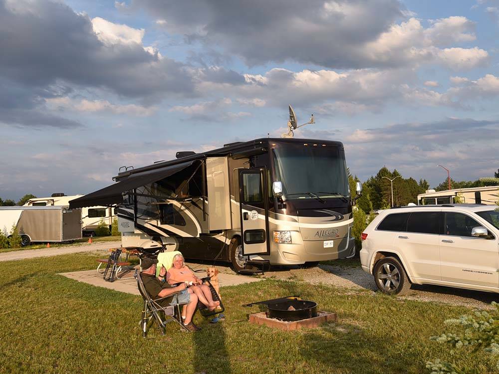 Pair of campers near motorhome at HEIDI'S CAMPGROUND