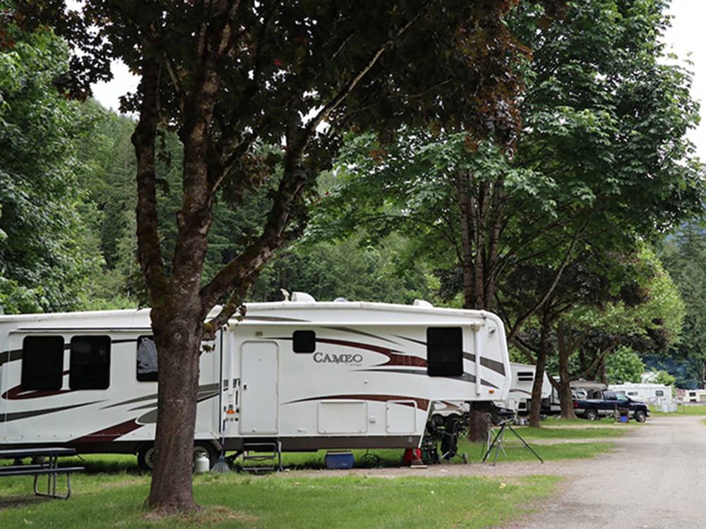 A fifth wheel trailer backed in at WILD ROSE CAMPGROUND & RV PARK